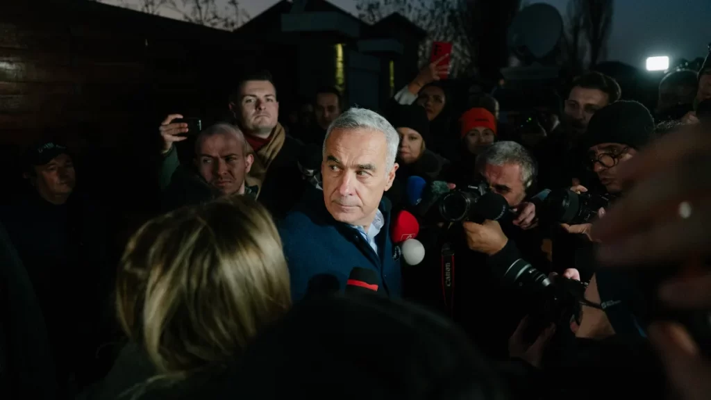 Romanian presidential candidate Calin Georgescu speaks to the media on November 26.